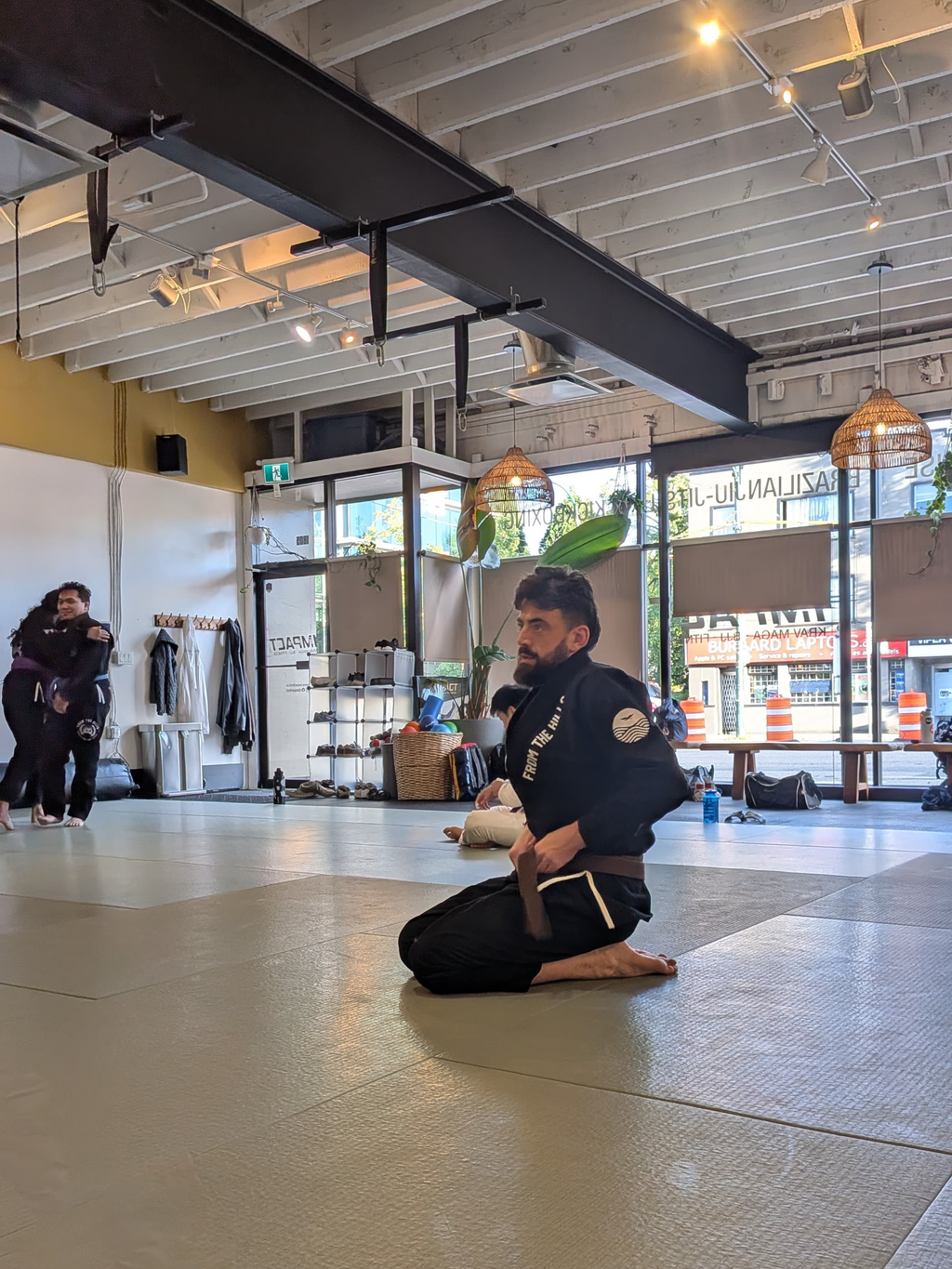 Gentle Art Collective Shinsei Gi from From The Hills Jiu Jitsu, white martial arts gi with black logo and reinforced stitching.