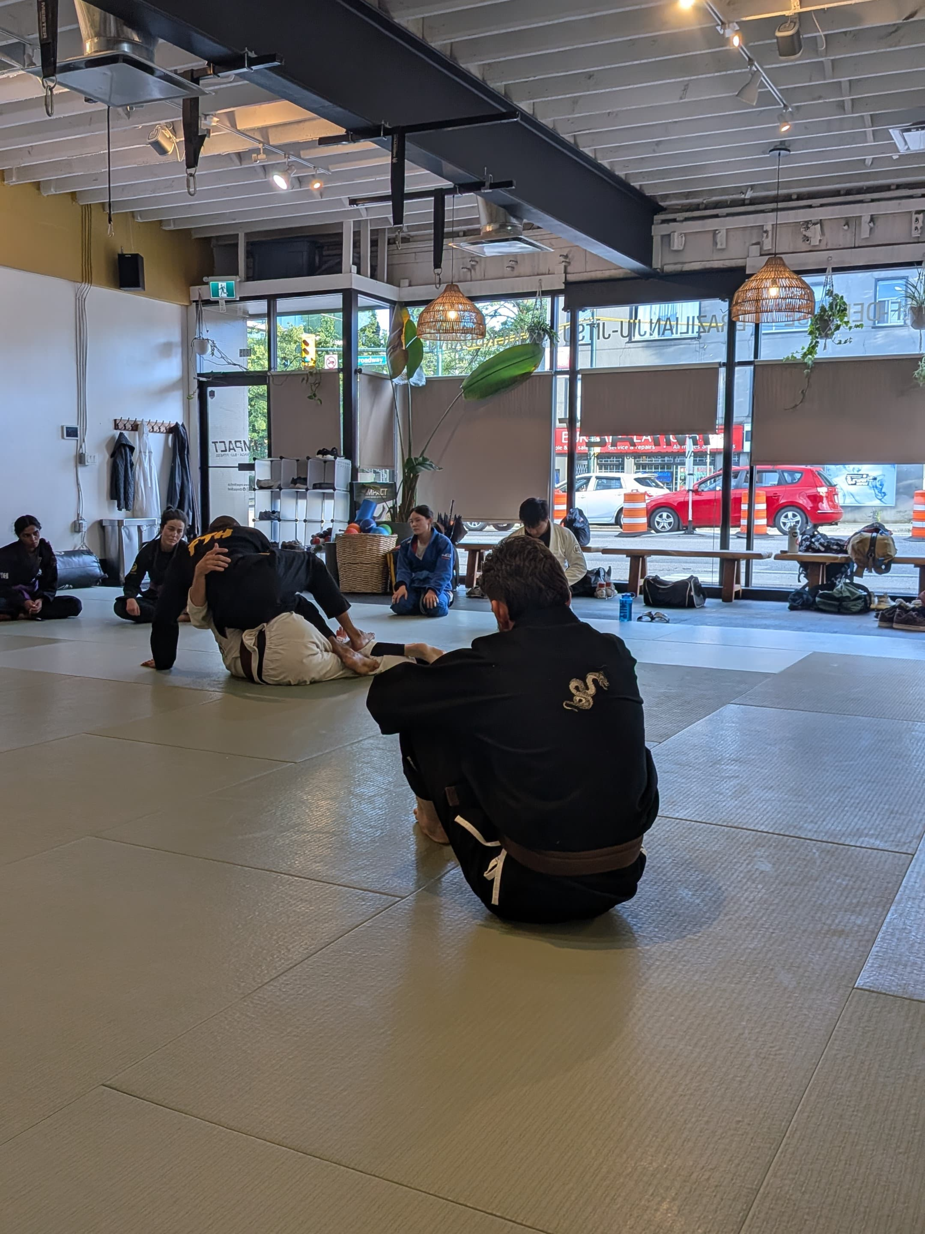 Gentle Art Collective Shinsei Gi from From The Hills Jiu Jitsu, displayed flat with white fabric and black collar details.