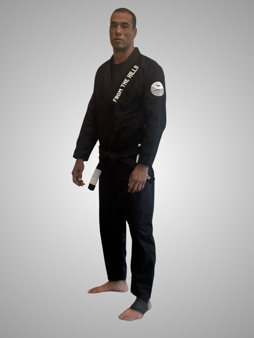 Shinsei Gi from The Hills Jiu Jitsu, Gentle Art Collective, featuring a white martial arts gi with logo patches and reinforced stitching.