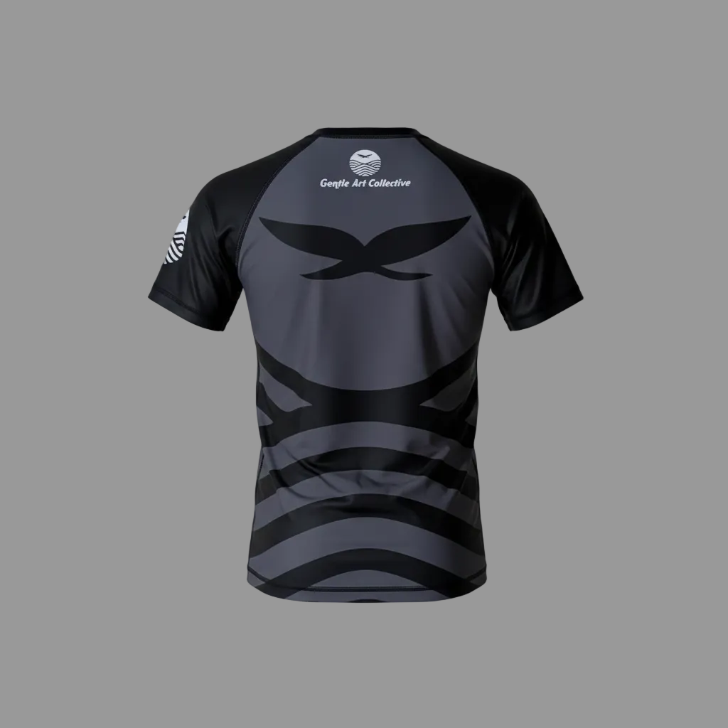 Black and gray sports RASH GUARD with branding on a light gray background